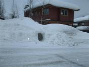 Snow tunnel inside a snowbank along the road